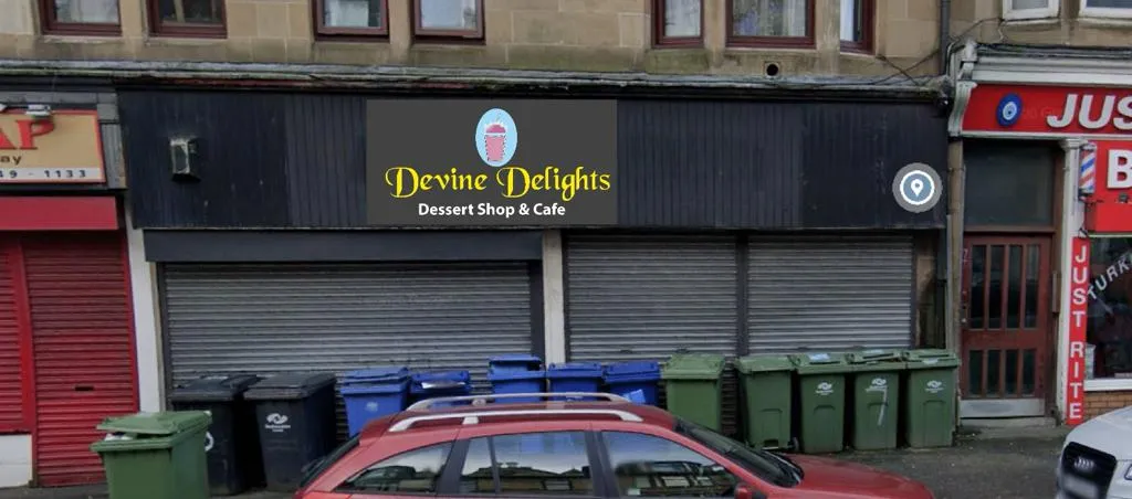 Devine Delights Signage at night in Paisley, Scotland
