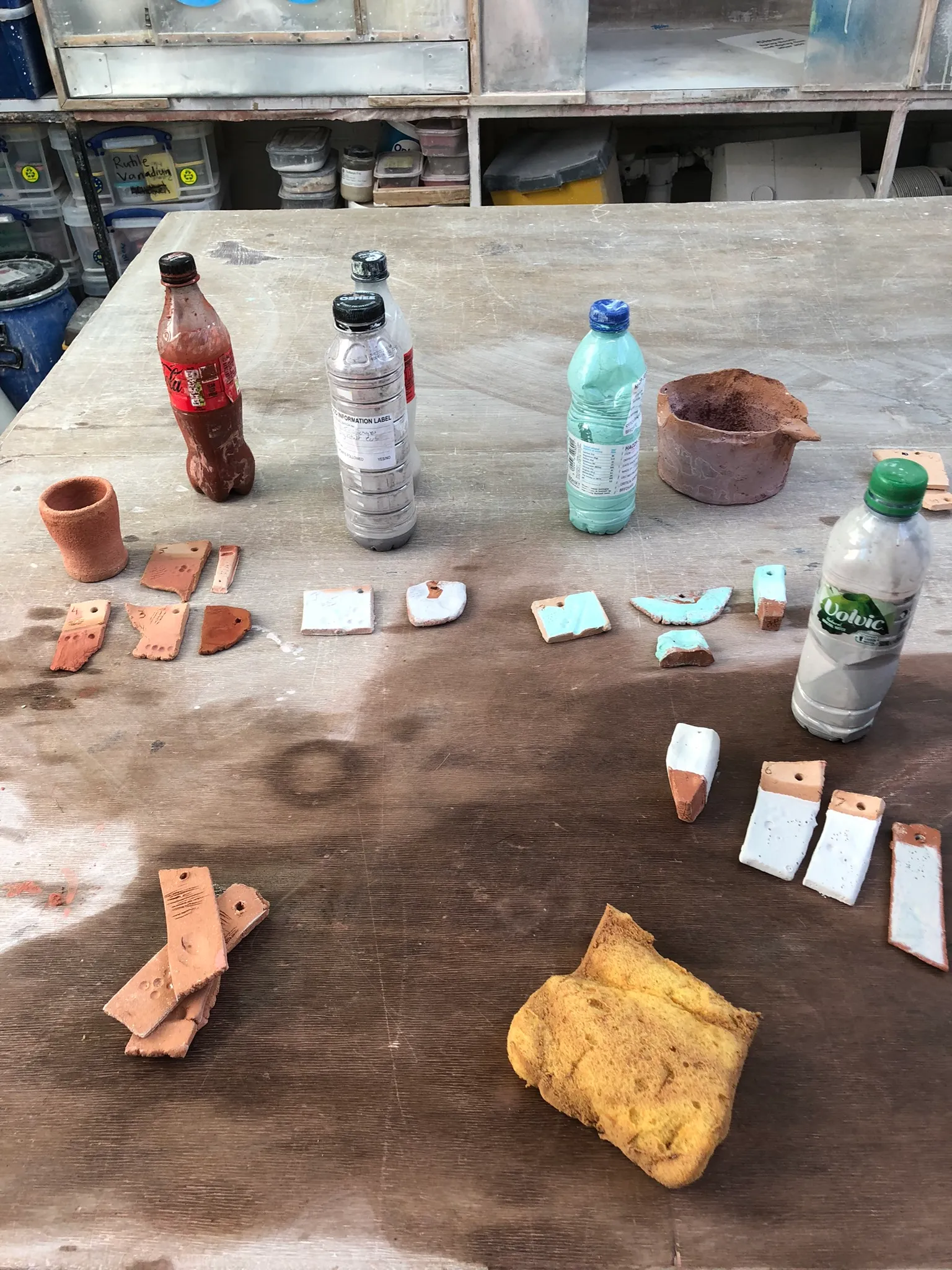 Workshop glaze testing — test tiles laid out for cone 6 and cone 9 firing schedules